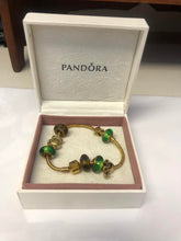Load image into Gallery viewer, Pandora gold-plated bracelet with charms
