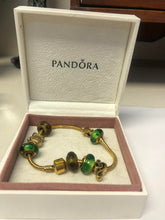 Load image into Gallery viewer, Pandora gold-plated bracelet with charms
